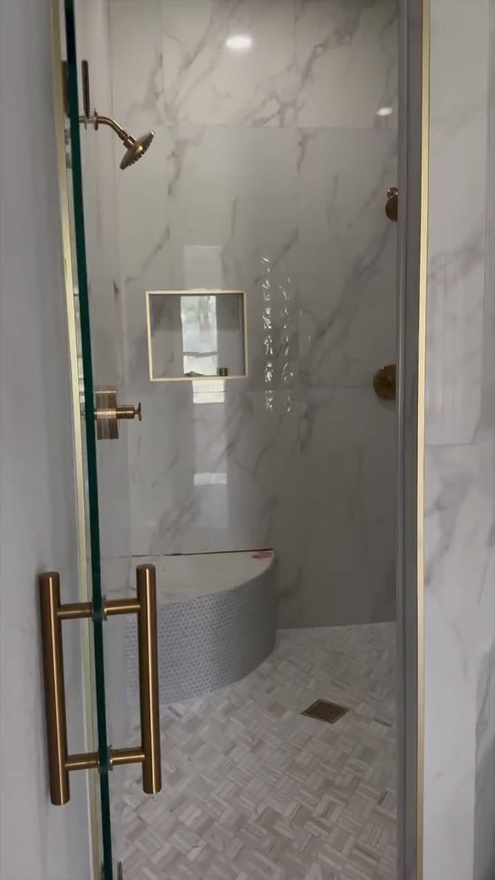 Finished New Life walk-in shower with frameless glass and coordinated tile