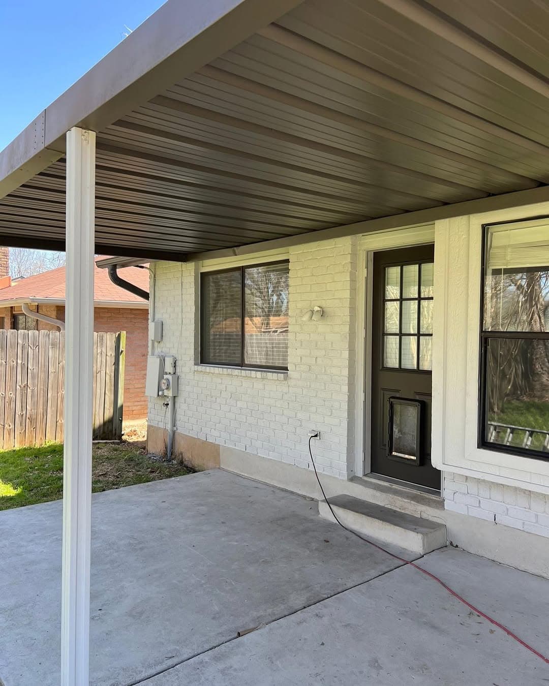 Covered patio exterior after coordinated painting and finish updates