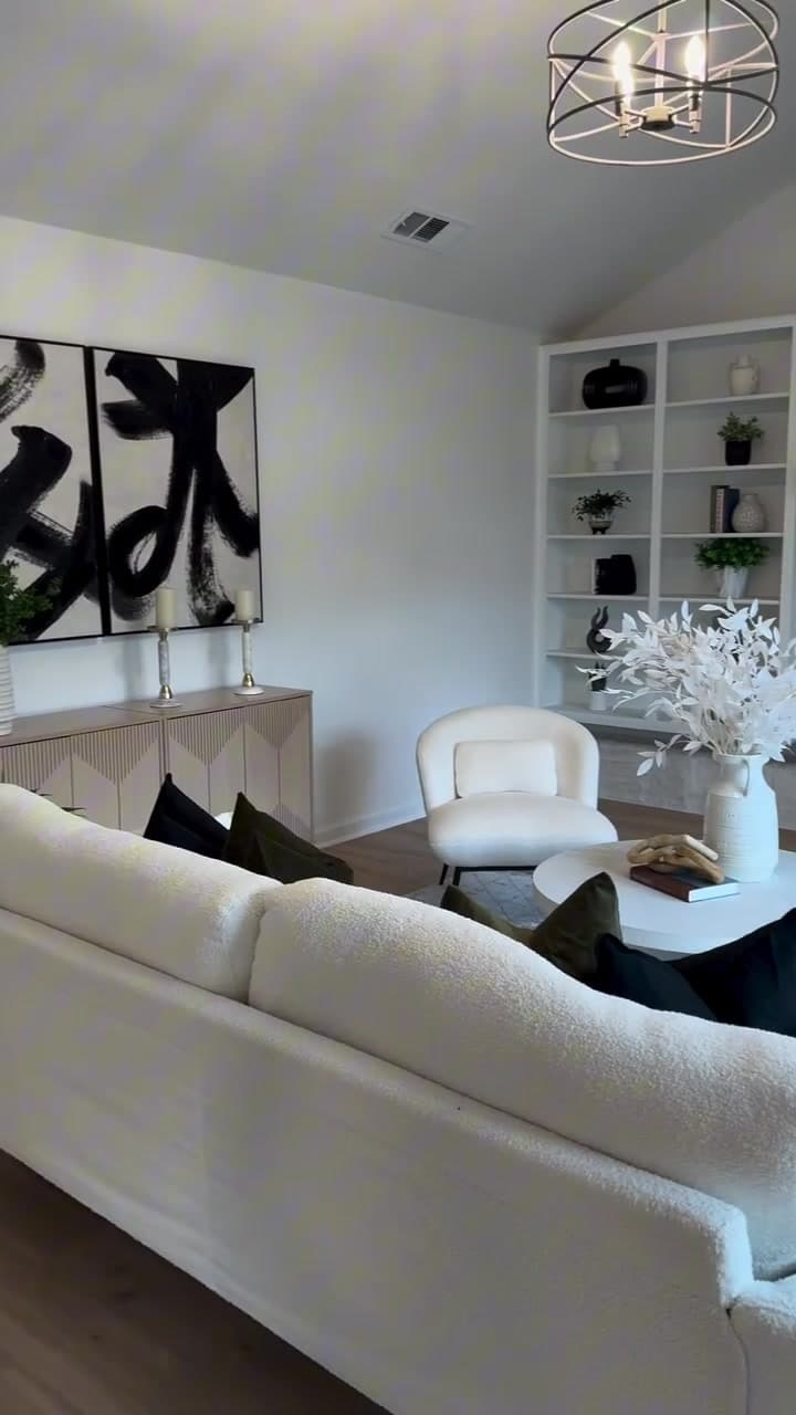 Finished fireplace wall with dark built-ins and a light stone surround in a New Life remodeling project