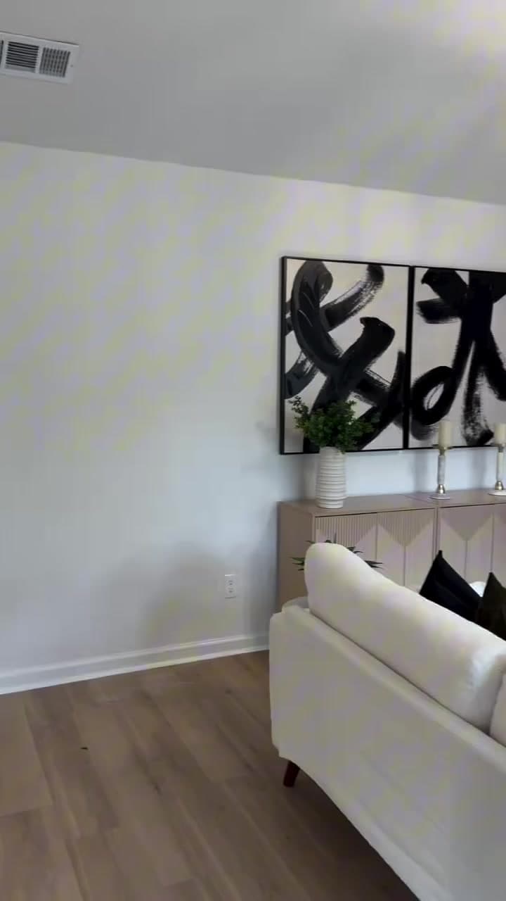 Finished New Life living room renovation with a rebuilt fireplace wall, built-ins, flooring, and coordinated interior finishes
