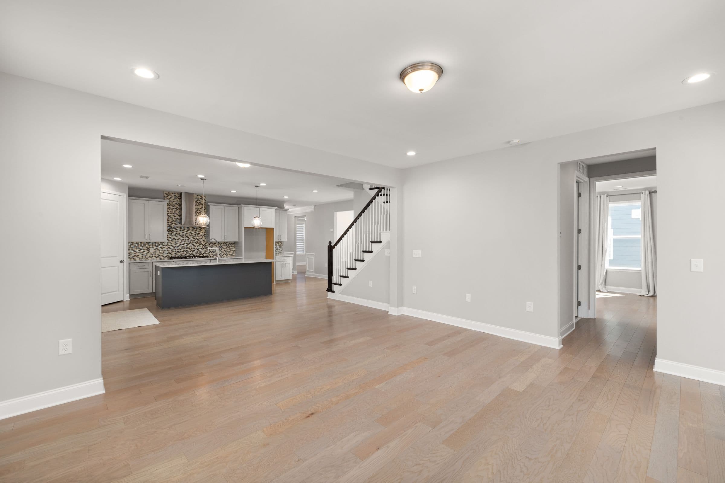 Open-plan home design inspiration with connected kitchen, dining, and living spaces